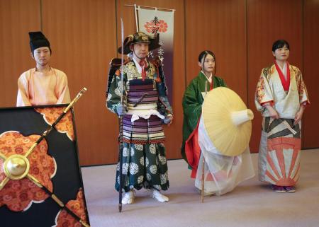 時代祭を前に、公開された（左２人目から）楠木正成の家来役のよろい、常盤御前の衣装など＝６日午前、京都市左京区